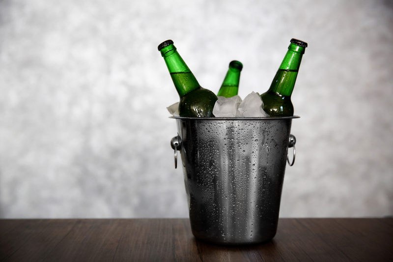 Cold beer bottles in an ice bucket
